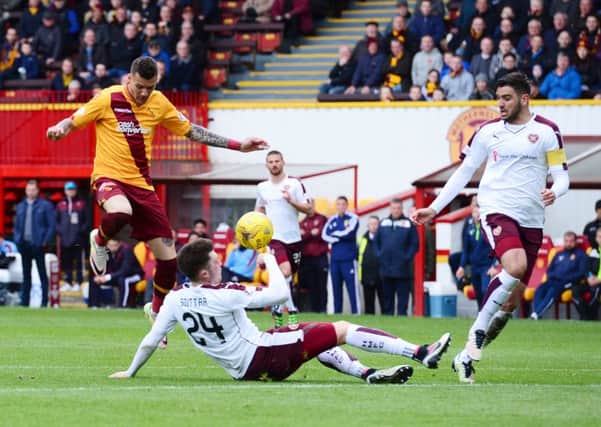 John Souttar makes a vital block for Hearts at Motherwell. Pic: SNS