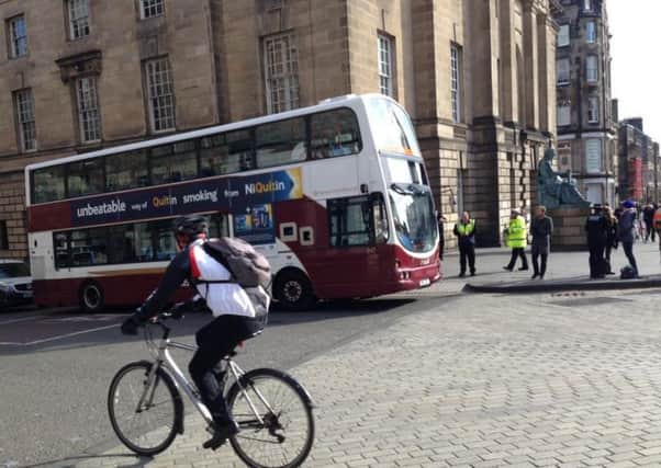 A bus has been involved in an incident at the junction of the Mound and Royal Mile. Picture: Colin Fraser/Facebook