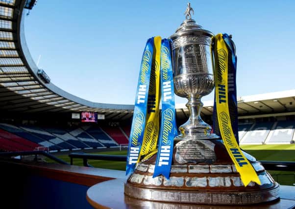 Hibs will face Rangers for the right to get their hands on the Scottish Cup trophy. Pic: SNS