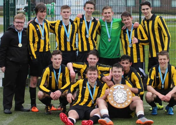 Dalkeith High School senior team.
Back(left to right) Reuben Earl (non kit) Craig Swanston, Jonathan Louden, Michael Lennie, Ronan Clelland, Euan Greig, Thomas Prior
Middle (left to right) Ross Hope, Ryan Fegan, Lucas Mason, Jack Combe
Front (left to right) Cameron Leslie, Andrew Fleming (captain, holding trophy)