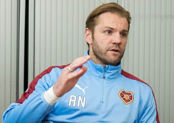 Robbie Neilson has demanded a reaction from Hearts after a flat performance against Motherwell