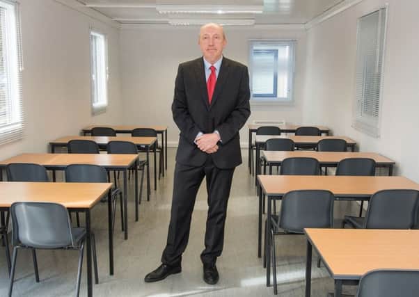 Cllr Andrew Burns at portacabin classrooms at the Royal High School. Picture: Ian Georgeson