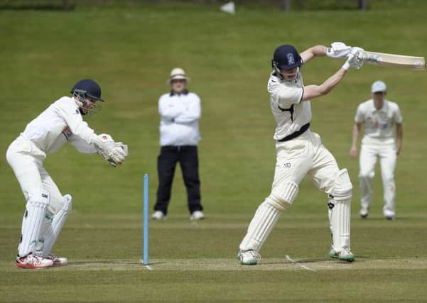 Carlton wicketkeeper Tom Simpson stands up to the wicket as Pete Ross bats for Heriots