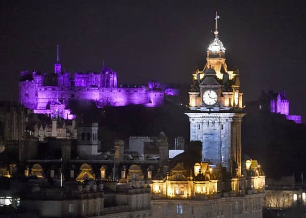 Edinburgh Castle is illuminated in purple light to mark the Stroke Association's 'Make May Purple'. Picture Jane Barlow