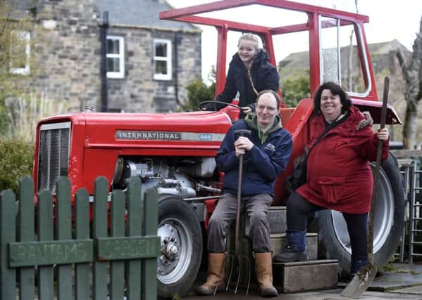 Tyler Paget, aged 14, Dominic Lambert, and Moira Black all work at Gorgie Farm as volunteers.Picture: Jane Barlow