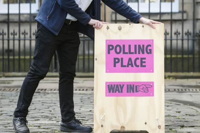 Council staff deliver signage and materials for set-up of the Lothian Chamber polling station ahead of tomorrow's election. Picture: Danny Lawson/PA Wire