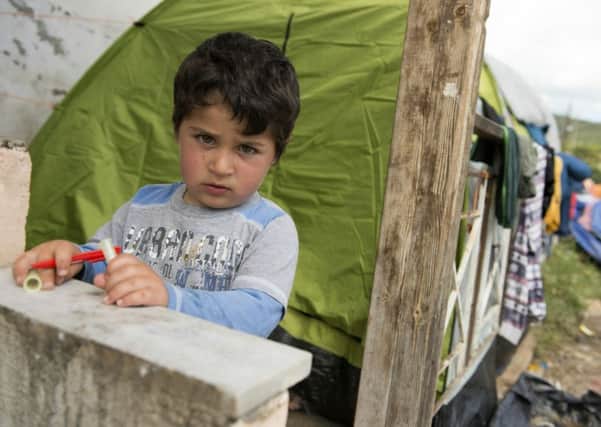 A boy at a makeshift camp for migrants and refugees. Picture: Getty