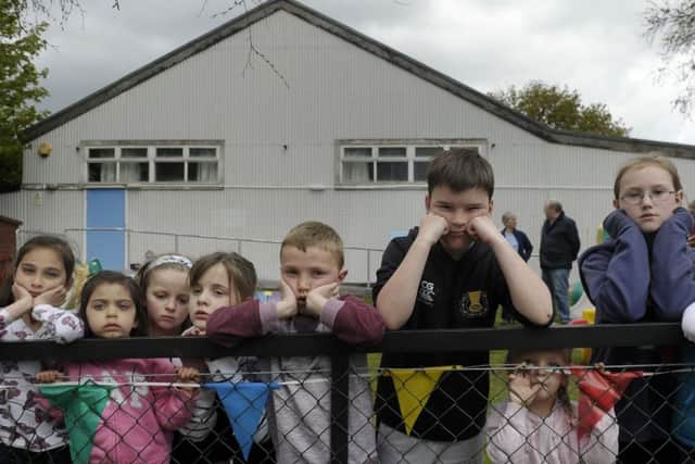 A group of concerned hall-users from the community assemble outside the Juniper Green Village Hall. Picture: Neil Hanna