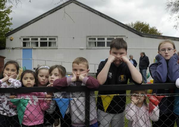 A group of concerned hall-users from the community  assemble outside the Juniper Green Village Hall. Picture: Neil Hanna
