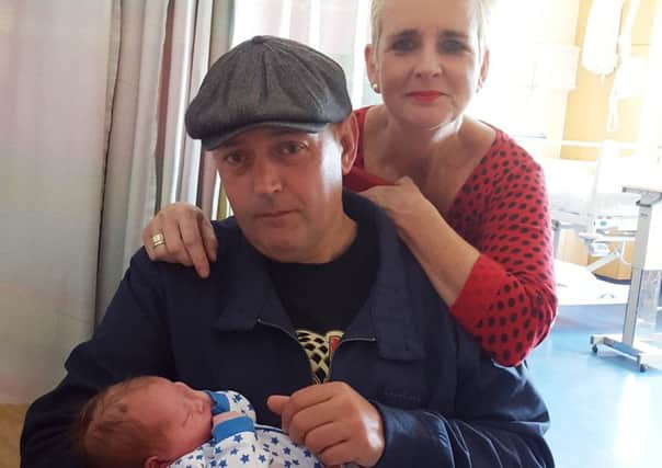 Keith Turner with his wife Lynn and grandson Karter. Picture: contributed