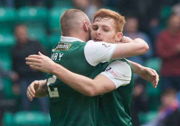 Fraser Fyvie, right, and David Gray celebrate Hibs victory over Raith. Pic: Toby Williams