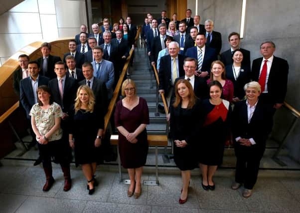 Tricia Marwick (centre) with the Scottish Parliaments new MSPs after they arrived at Holyrood. Picture: PA