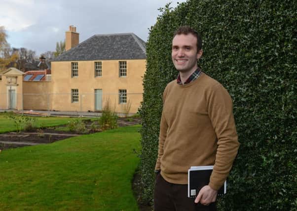 Sutherland Forsyth, community engagement co-ordinator and capital projects manager, with the restored cottage late last year. Picture: Neil Hanna