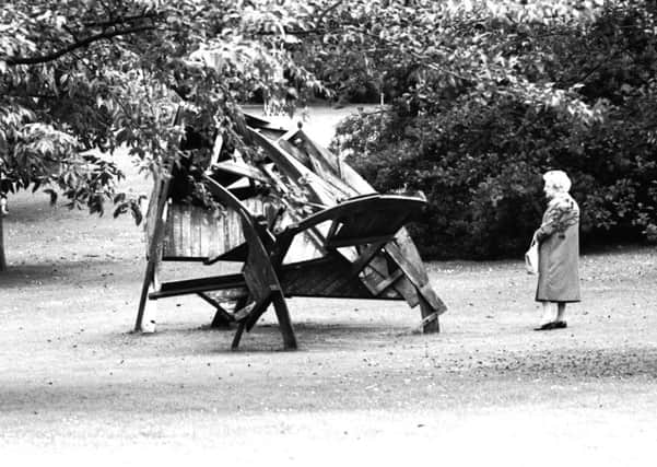 An elderly woman stops to look at the large wooden sculpture Orbit II in the Royal Botanic Gardens Edinburgh, August 1980