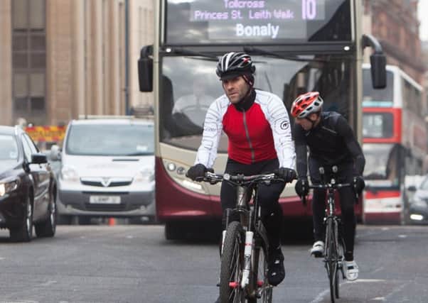 Cyclists on Lothian Road. Picture: Toby Williams
