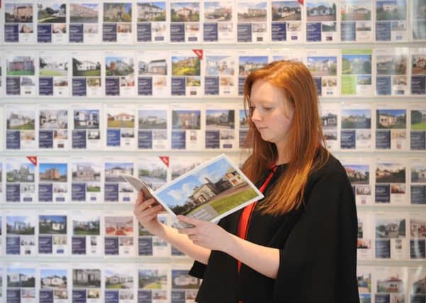 A potential buyer peruses the properties displayed at the ESPC shop in George Street. Picture: Jane Barlow