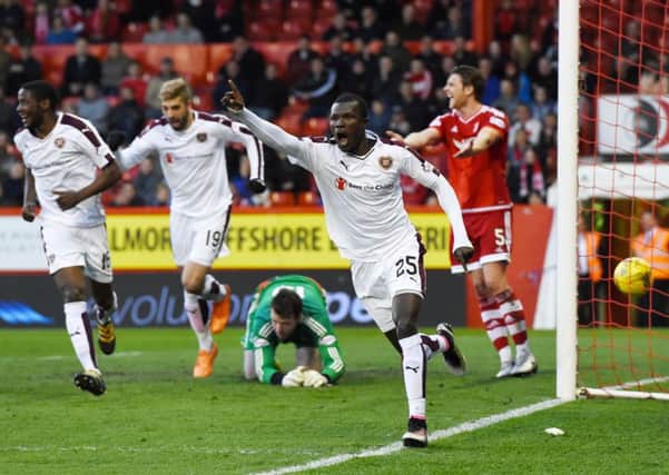 Abiola Dauda celebrates having scored what proved to be the winner at Pittodrie
