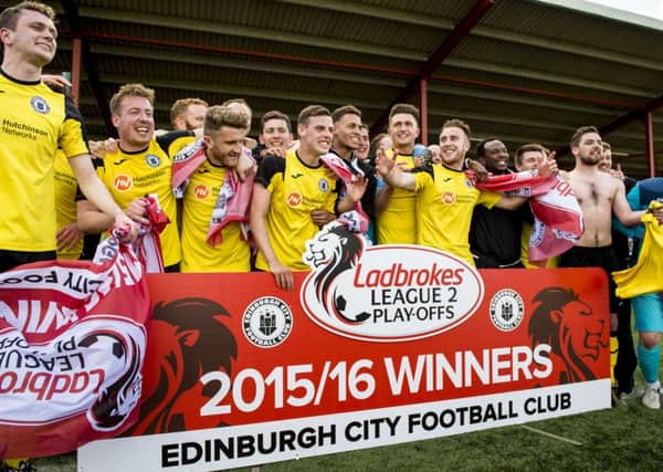 Edinburgh Citys players celebrate promotion to League 2 after beating East Stirling 1-0 at Ochilview. Pic: SNS