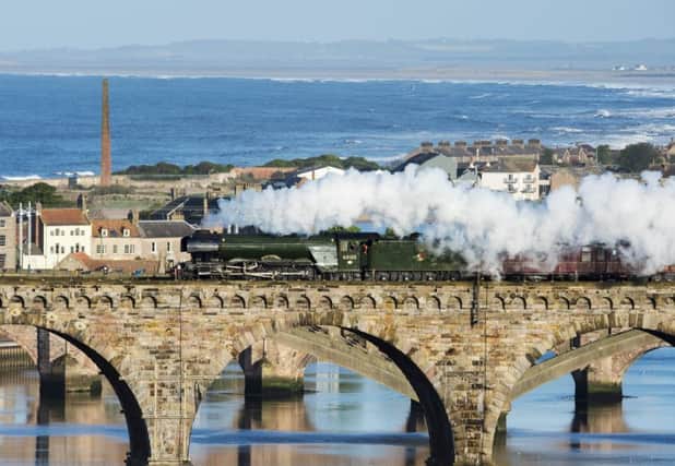 The Flying Scotsman crosses the Royal Border Bridge at Berwick-Upon-Tweed en route from York to Edinburgh Waverley. Picture: Ian Rutherford