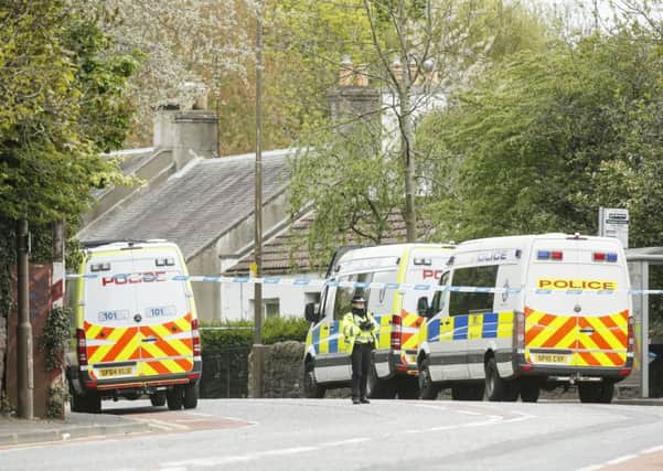 Police vans at the scene on Old Dalkeith Road