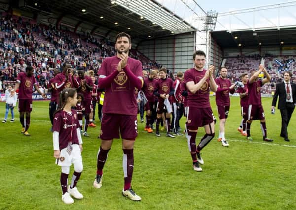 The Hearts players undertake a lap of honour after the 2-2 draw