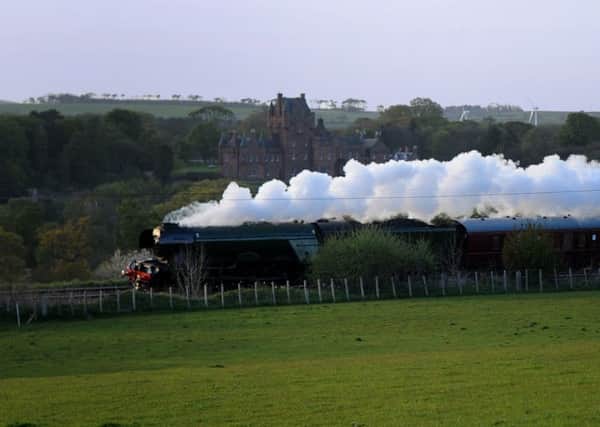 The Flying Scotsman passes Ayton Castle on the East Coast mainline on route to Edinburgh. Picture: Kimberley Powell
