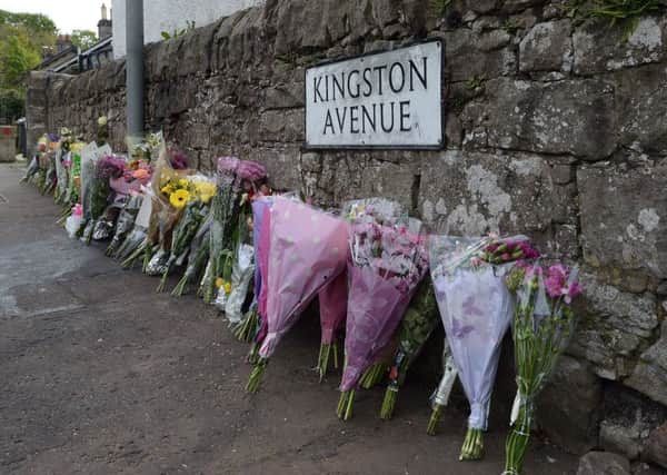 Tributes left near the scene of the accident on Old Dalkeith Road. Picture: Neil Hanna