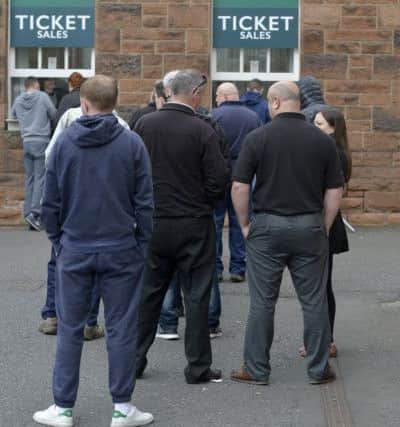Registered Hibs supporters queue for Scottish Cup final tickets at Easter Road. Picture: Julie Bull
