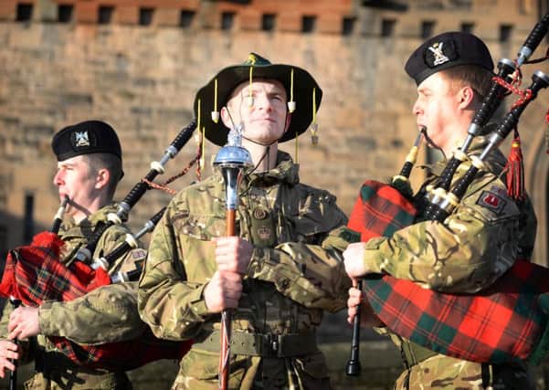 Drum Major Mick Hay of the Royal Regiment of Scotland swaps traditional Army headress for something a bit more 'fun' ahead of the Down Under tour. Picture: Mark Owen