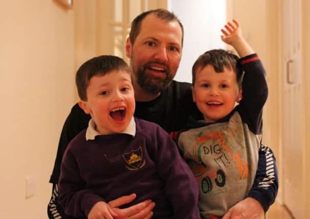 Cormac Fegan, left, with dad Gary and brother Ronan. Picture: contributed