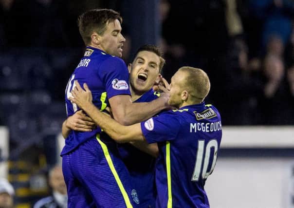 Darren McGregor, far left, is joined by Paul Hanlon and Dylan McGeouch after his goal against Raith Rovers. Pic: SNS