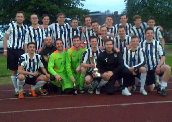 Leith Athletic celebrate with the trophy