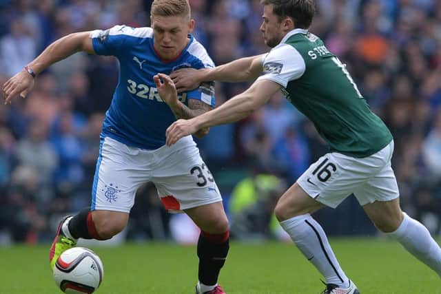 Martyn Waghorn of Rangers takes on Lewis Stevenson of Hibs. Picture: Getty