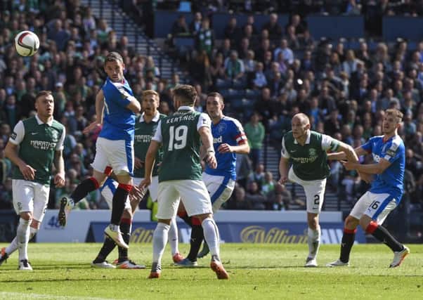 Hibernian's David Gray (second from right) scores the winner. Picture: SNS