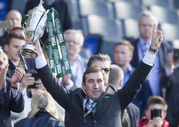 Hibernian manager Alan Stubbs lifts the cup. Picture: PA