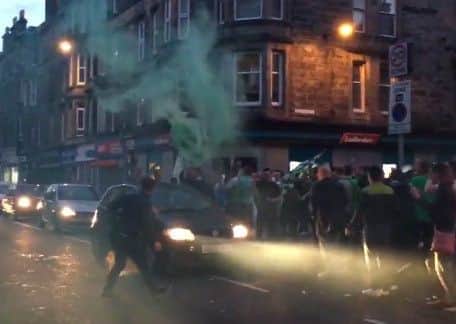 Fans celebrate on Easter Road. Picture: Lizzy Buchan
