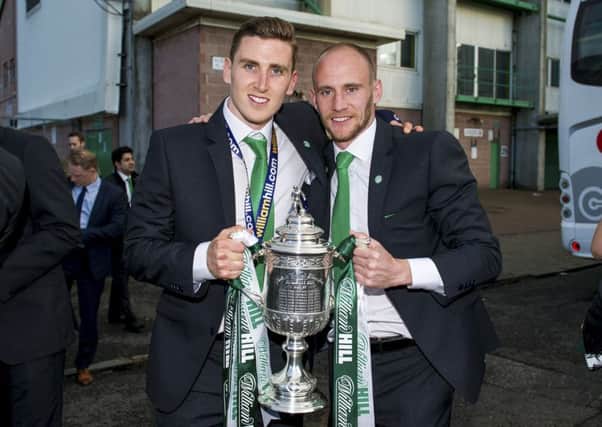 Paul Hanlon (left) and David Gray with the trophy at Easter Road on Sunday evening. Picture: SNS