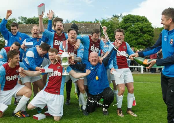 Whitehill Welfare celebrate their victory in the South Challenge Cup Final. Pic: Toby Williams