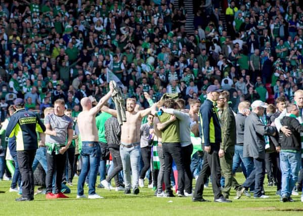 Hibs fans swarm the pitch after the Scottish Cup win. Picture: Alan Harvey/SNS Group