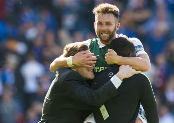 Hibs striker James Keatings celebrates with Jamie Insall, left, and Marvin Bartley at full time in Saturdays Scottish Cup final. Pic: SNS