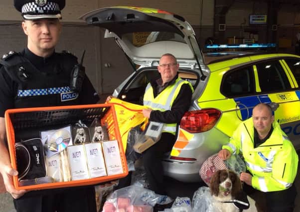 Police displaying seized counterfeit goods. Picture: Police Scotland