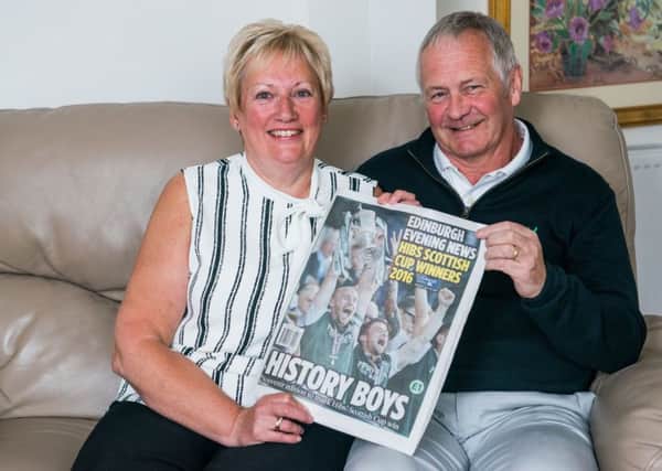 Elaine and Peter Gray, the parents of Hibs Scottish Cup winning captain David, show off the Evening News' special edition. Pic: Ian Georgeson