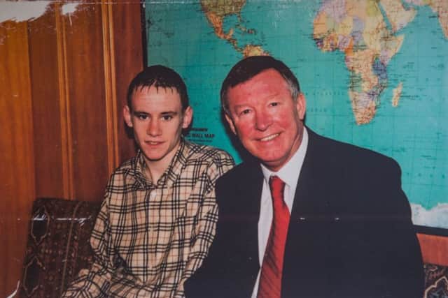 A 
teenage David Gray meets Sir Alex Ferguson prior to signing for Manchester United in 2005