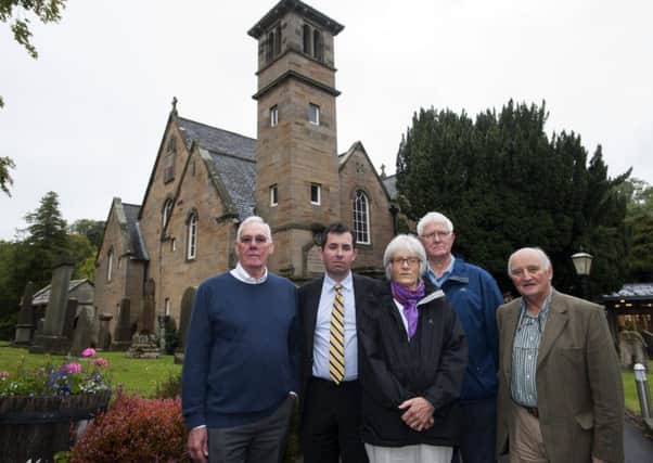 Councillor Jason Rust, second from left, joined other community campaigners to block the changes. Picture: Lesley Martin
