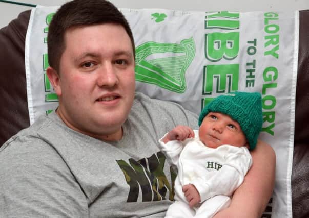 Sam Faichney with his baby son Edward. Picture: Jon Savage