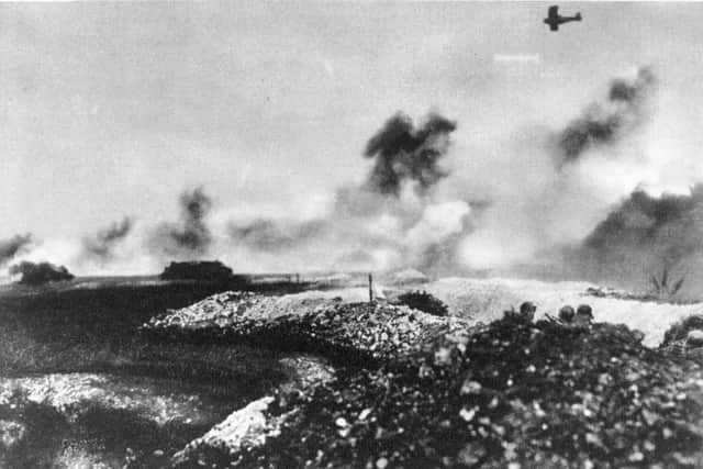 A tank and air battle near Cambrai on the Western Front. The heads of German soldiers can be seen in the right foreground.   (Photo by Robert Sennecke/Getty Images)