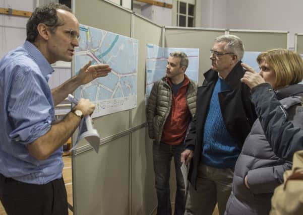 City council official Phil Noble speaks to locals about the cycle path plan at a public meeting in Roseburn Primary. Picture: Phil Wilkinson