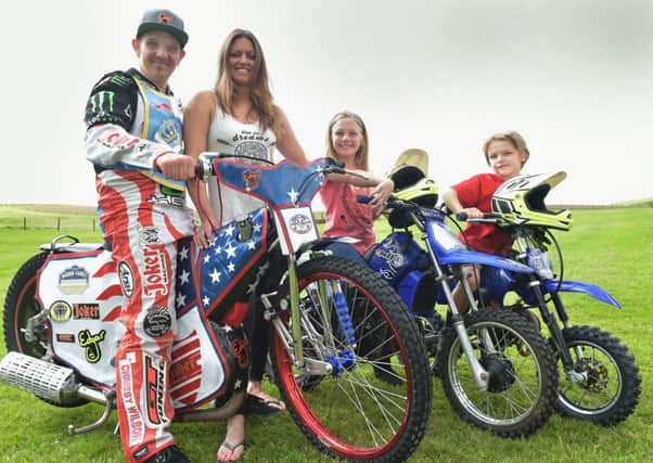 Edinburgh Monarchs rider Ryan Fisher with wife Daelyn, daughter Abbyjo and son Harley. Pic: Ron MacNeill