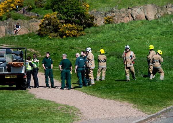 Emergency services in attendance at Arthur's Seat, where the woman fell. Picture: Wullie Marr