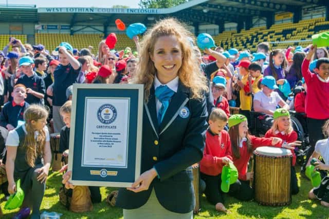 Guinness World Record adjudicator Anna Orford presents the certificate. Picture: Ian Georgeson